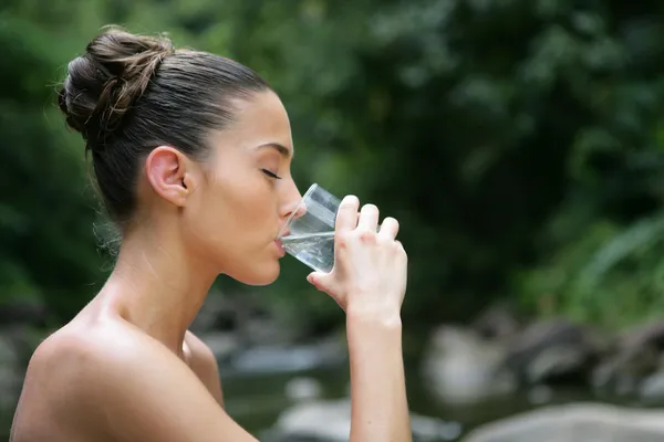 Women drinking water outside